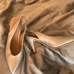 Silver slingback pumps